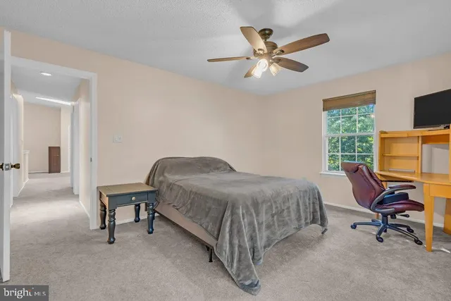 a bedroom with a workspace