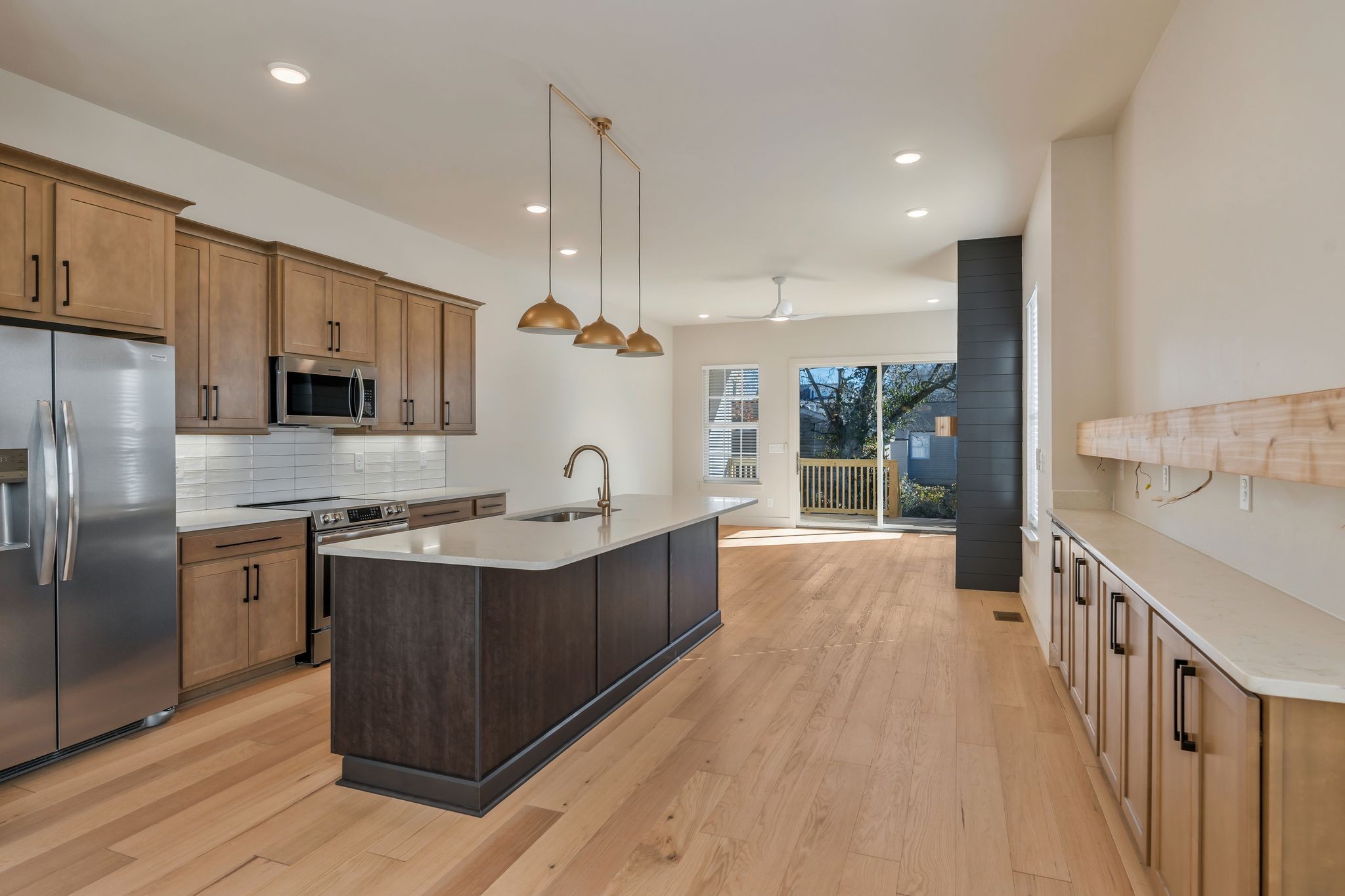 915 B Marilyn Road Nashville, TN 37209 - Photo 15 of 44 a kitchen with stainless steel appliances granite countertop a sink a stove and a refrigerator