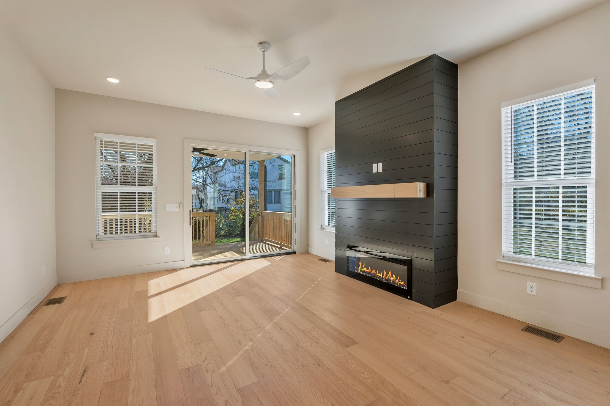 915 B Marilyn Road Nashville, TN 37209 - Photo 17 of 44 a view of an empty room with a fireplace and a window