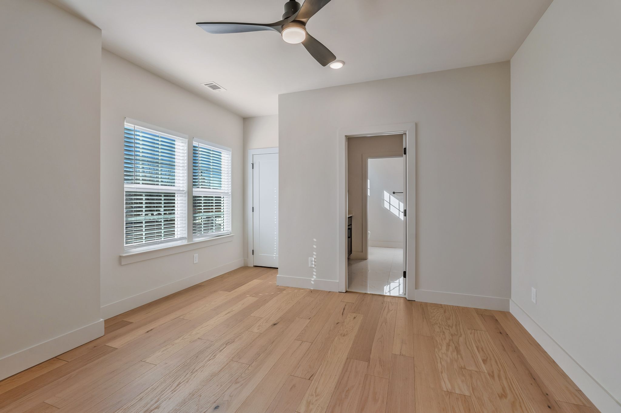 915 B Marilyn Road Nashville, TN 37209 - Photo 23 of 44 a view of an empty room with wooden floor and a window