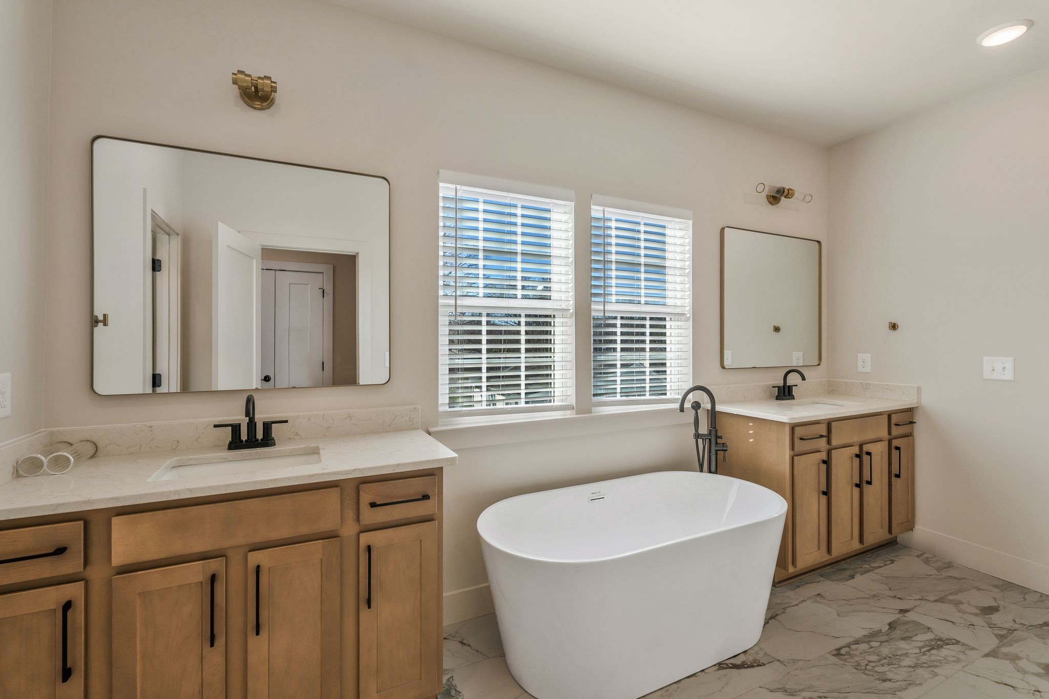 915 B Marilyn Road Nashville, TN 37209 - Photo 32 of 44 a bathroom with a tub double sink window and mirror