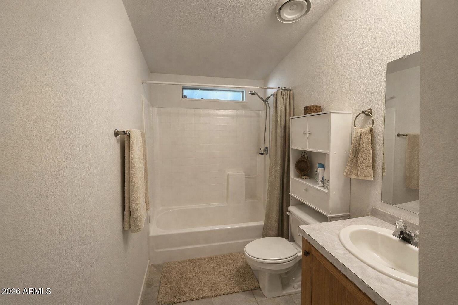 3700 South Tomahawk Road, Unit 13 Apache Junction, AZ 85119 - Photo 15 of 19 a bathroom with a granite countertop sink toilet and shower