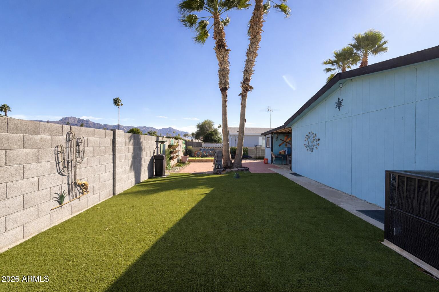 3700 South Tomahawk Road, Unit 13 Apache Junction, AZ 85119 - Photo 17 of 19 a view of a porch with furniture and garden