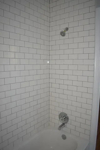 a bathroom with a white shower