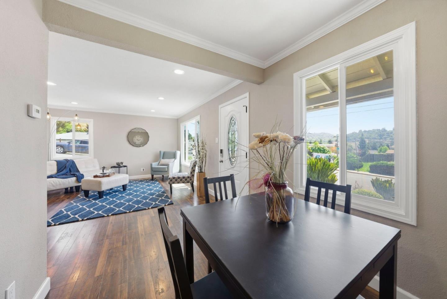 2793 Ruff Court Pinole, CA 94564 - Photo 15 of 53 a living room with dining table and a large window
