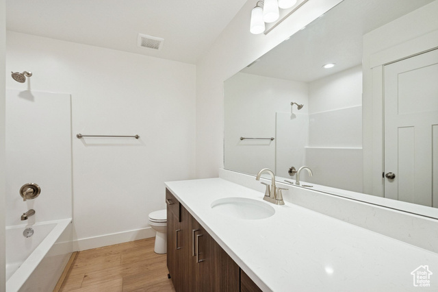 1615 North Angel Street, Unit E Layton, UT 84041 - Photo 27 of 42 Bathroom with shower / tub combination, light wood-style floors, and vanity
