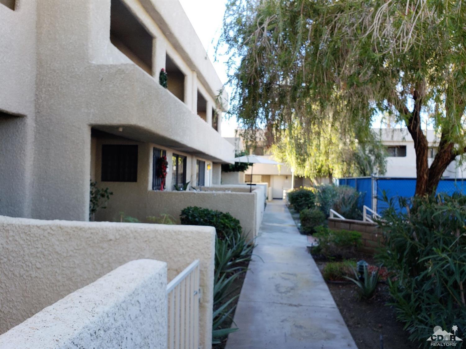 69575 Karen Way Rancho Mirage, CA 92270 - Photo 2 of 14 a backyard of a house with lots of green space