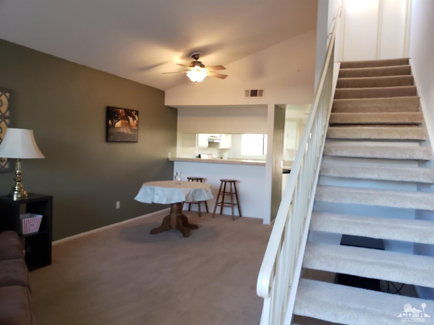 69575 Karen Way Rancho Mirage, CA 92270 - Photo 3 of 14 a view of a livingroom with furniture and staircase