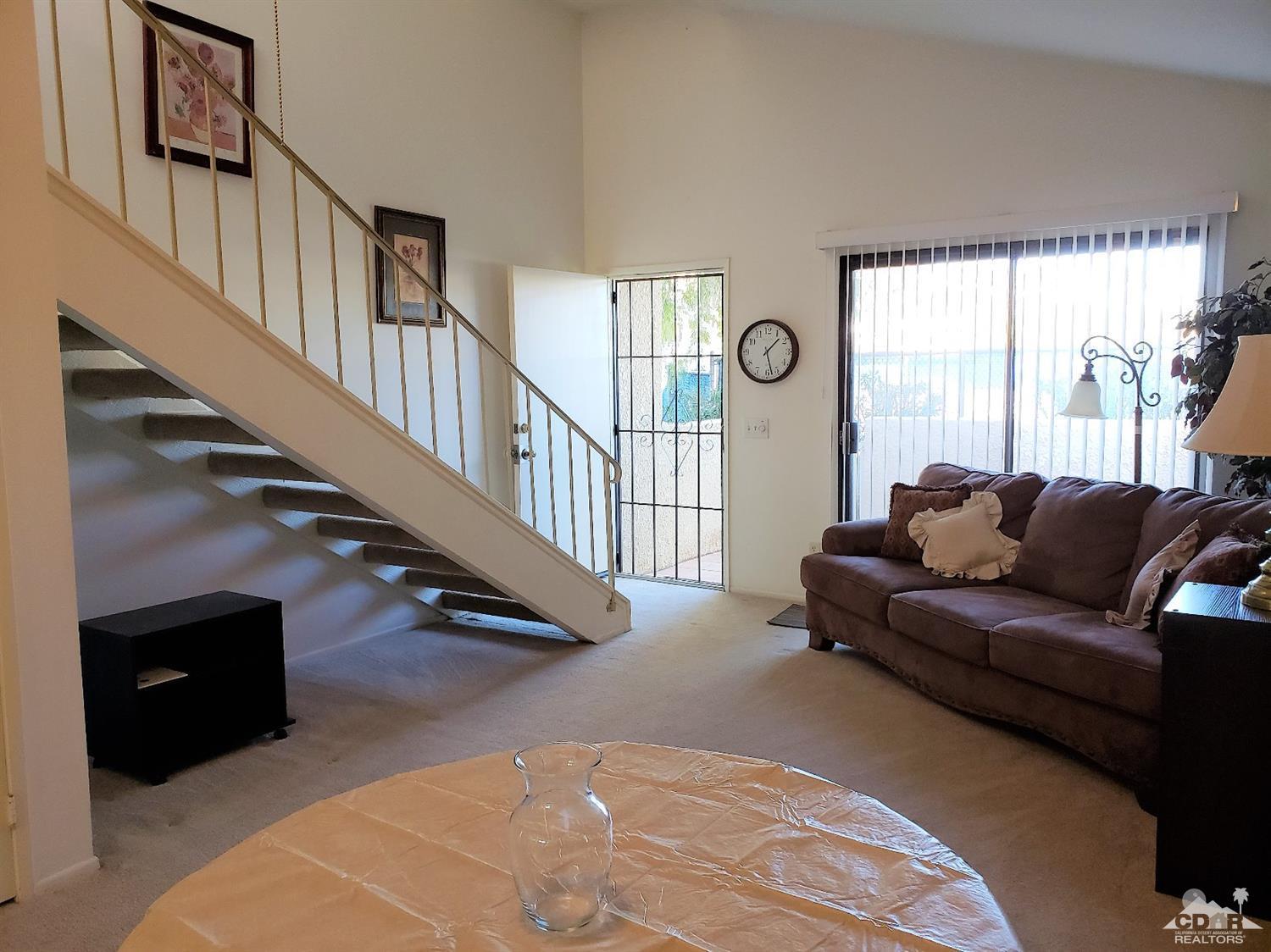 69575 Karen Way Rancho Mirage, CA 92270 - Photo 6 of 14 a living room with furniture and a window