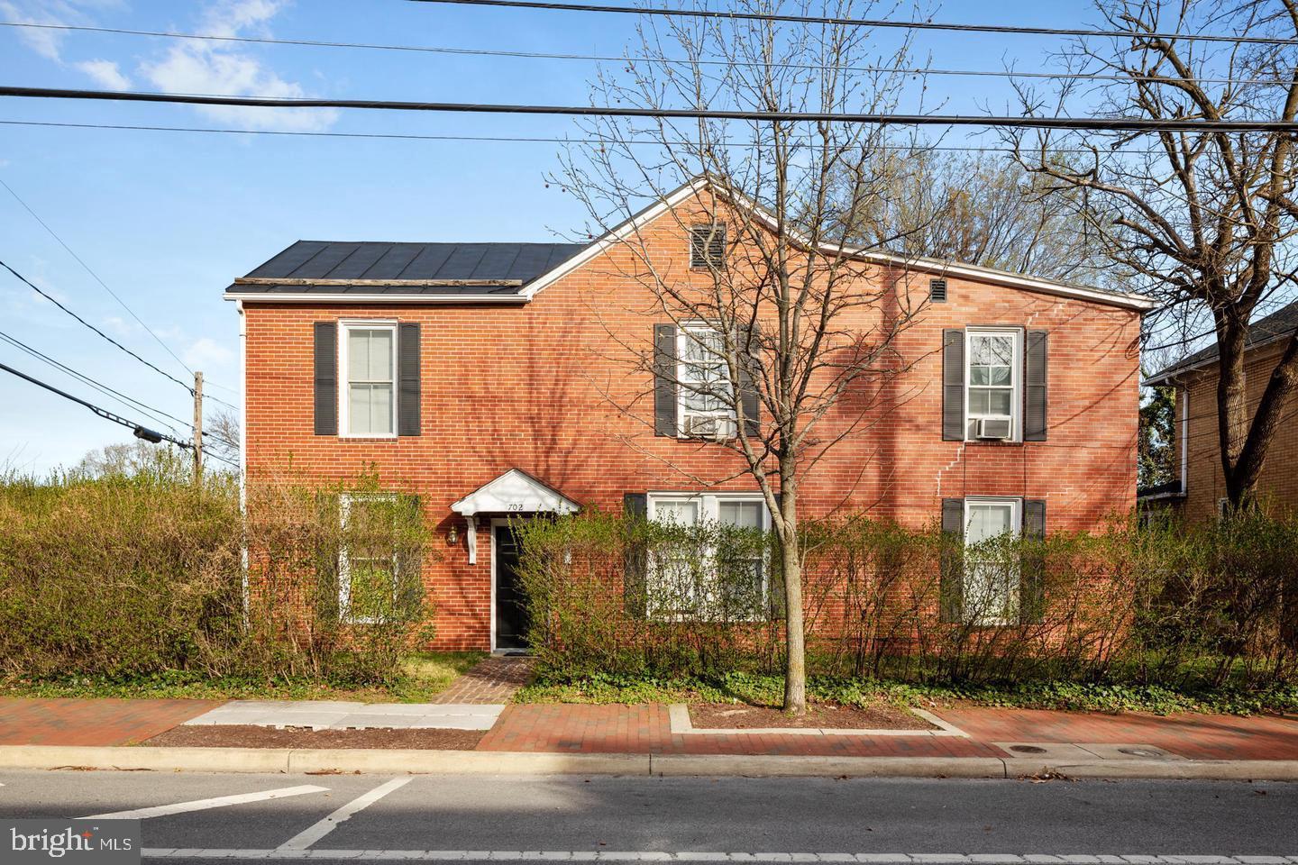 702 South Braddock Street, Unit 3 Winchester, VA 22601 - Photo 1 of 12 a view of street along with house and trees