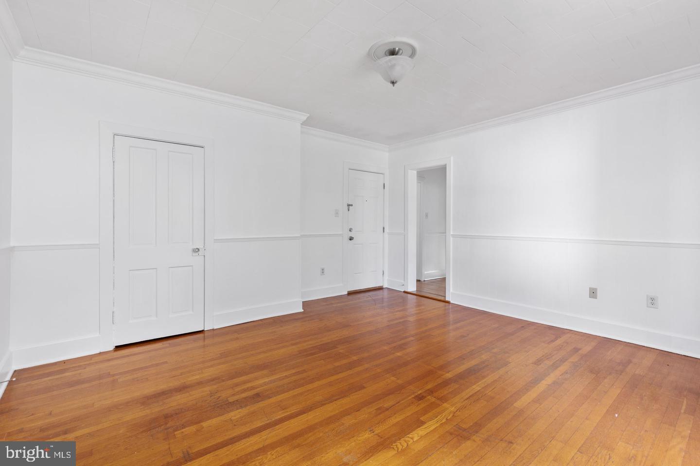 702 South Braddock Street, Unit 3 Winchester, VA 22601 - Photo 4 of 12 wooden floor in an empty room