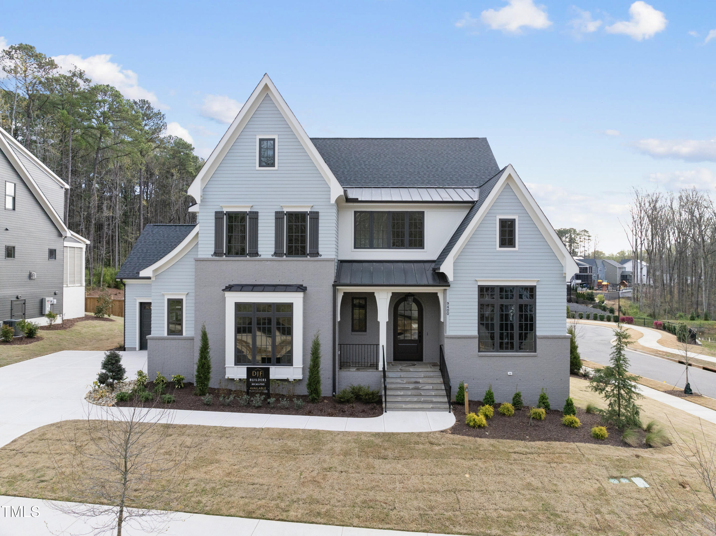 9400 Rawson Avenue Raleigh, NC 27613 - Photo 1 of 33 a front view of a house with a yard