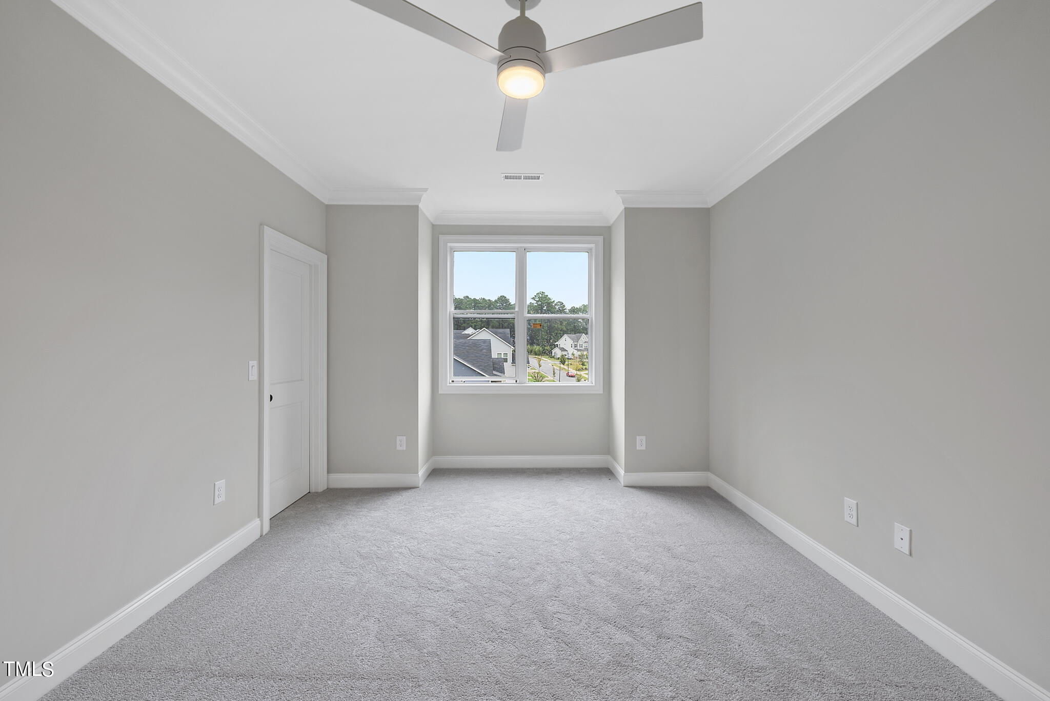 9400 Rawson Avenue Raleigh, NC 27613 - Photo 25 of 33 an empty room with windows and ceiling fan