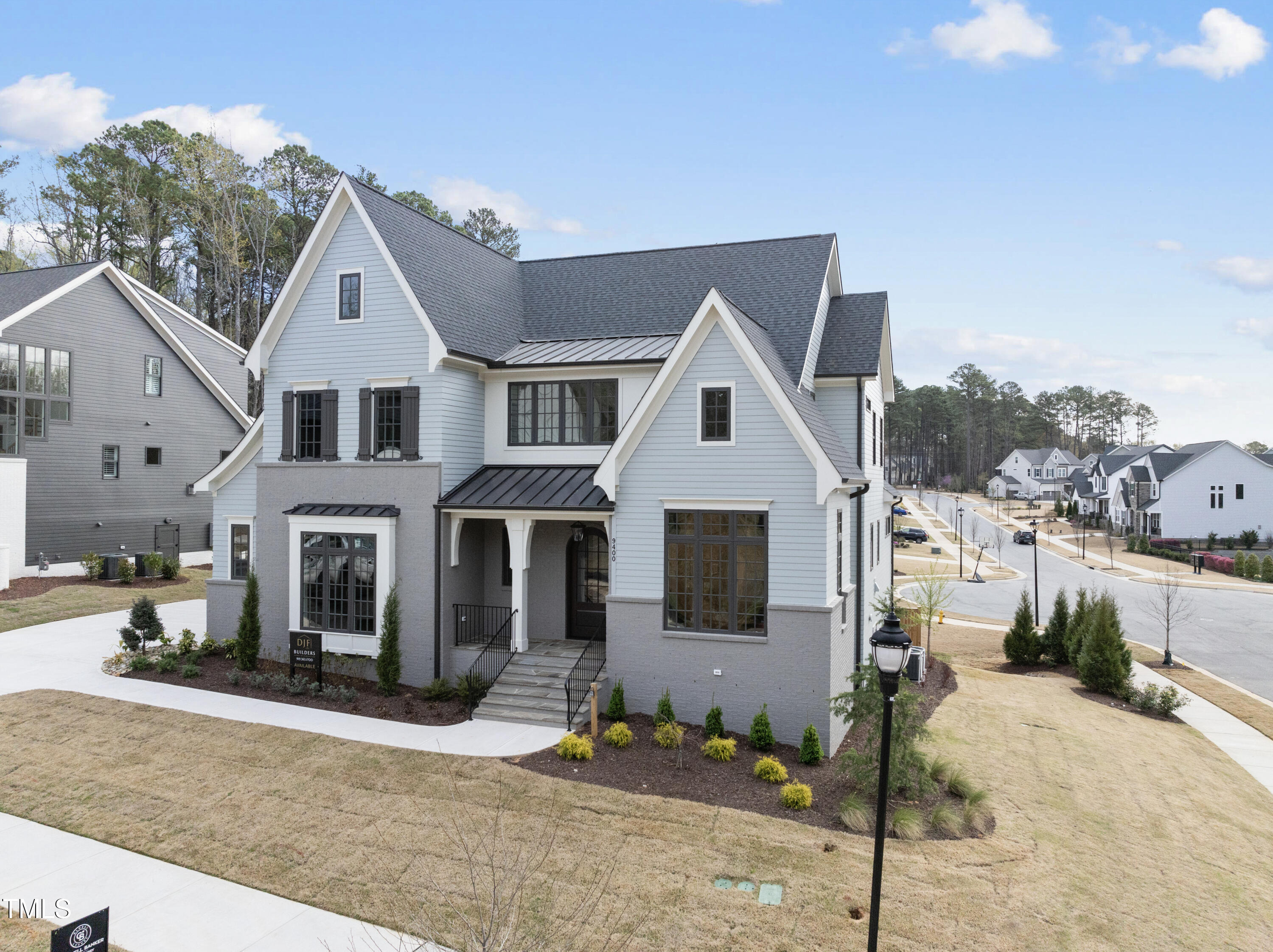 9400 Rawson Avenue Raleigh, NC 27613 - Photo 3 of 33 a front view of a house with a yard