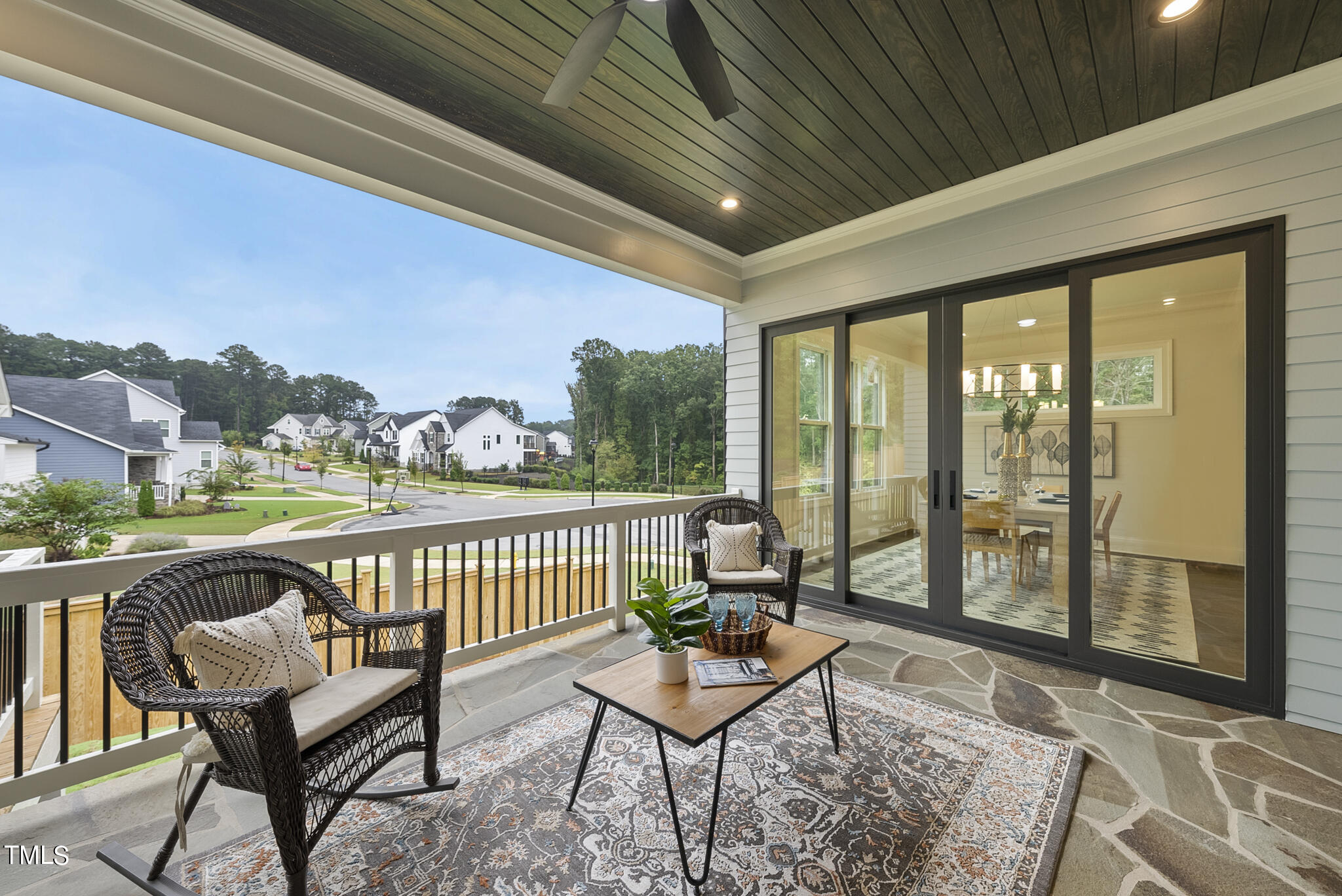9400 Rawson Avenue Raleigh, NC 27613 - Photo 31 of 33 a balcony with chairs and wooden floor