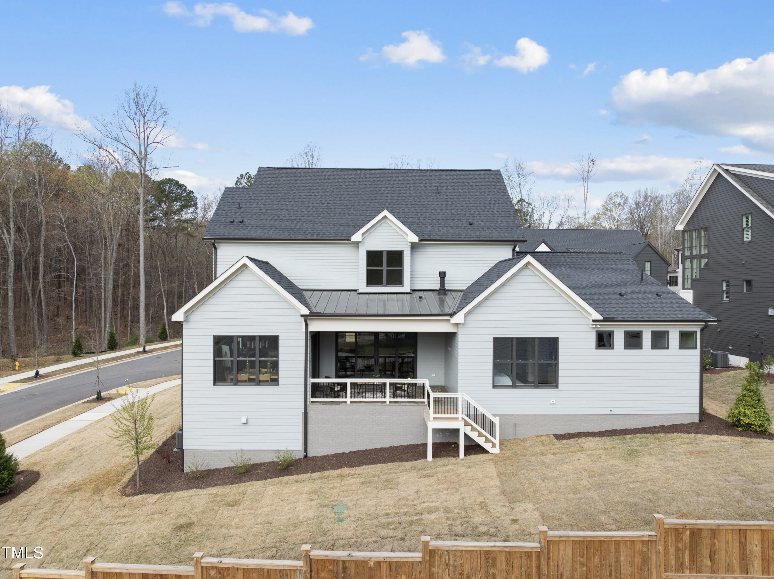 9400 Rawson Avenue Raleigh, NC 27613 - Photo 32 of 33 a front view of a house with garage