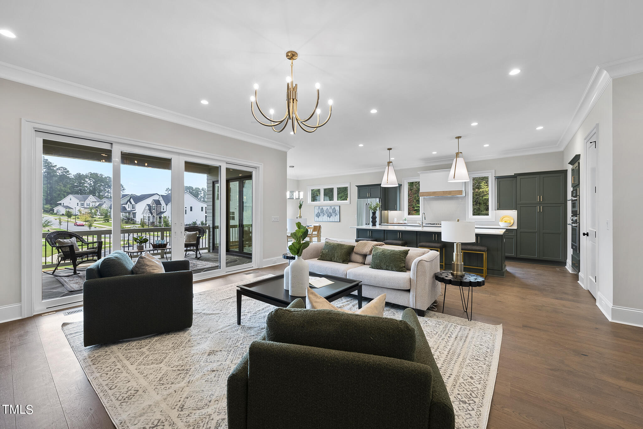 9400 Rawson Avenue Raleigh, NC 27613 - Photo 10 of 33 a living room with furniture kitchen area and a large window