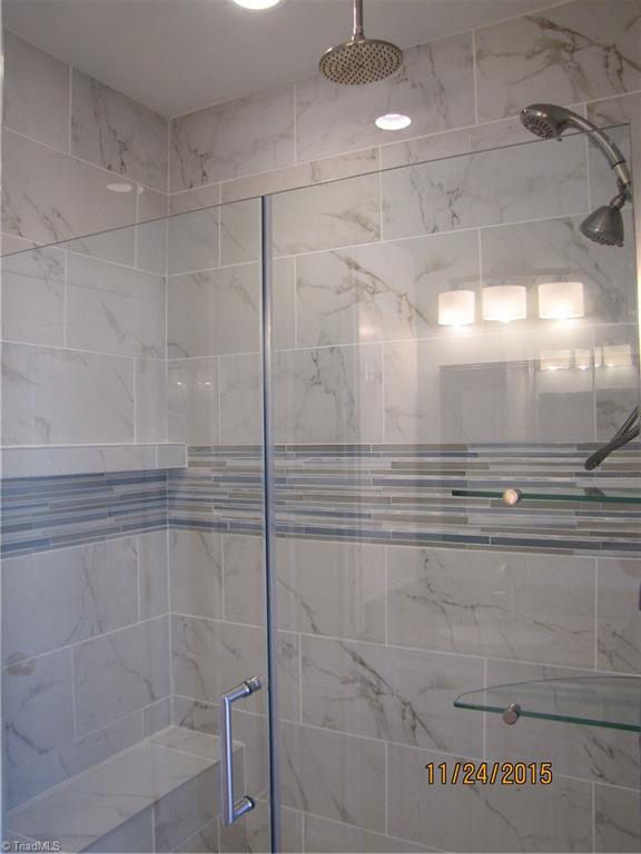 3627 Ruby Road Winston-Salem, NC 27106 - Photo 15 of 30 MBA: Large tiled rain shower with shelves and seat.