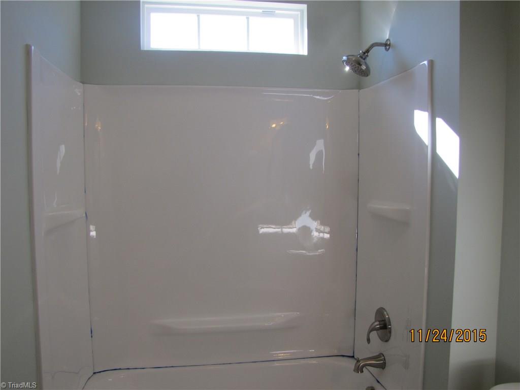 3627 Ruby Road Winston-Salem, NC 27106 - Photo 19 of 30 Eyebrow Window allows natural light to shine in this Hall Bath.