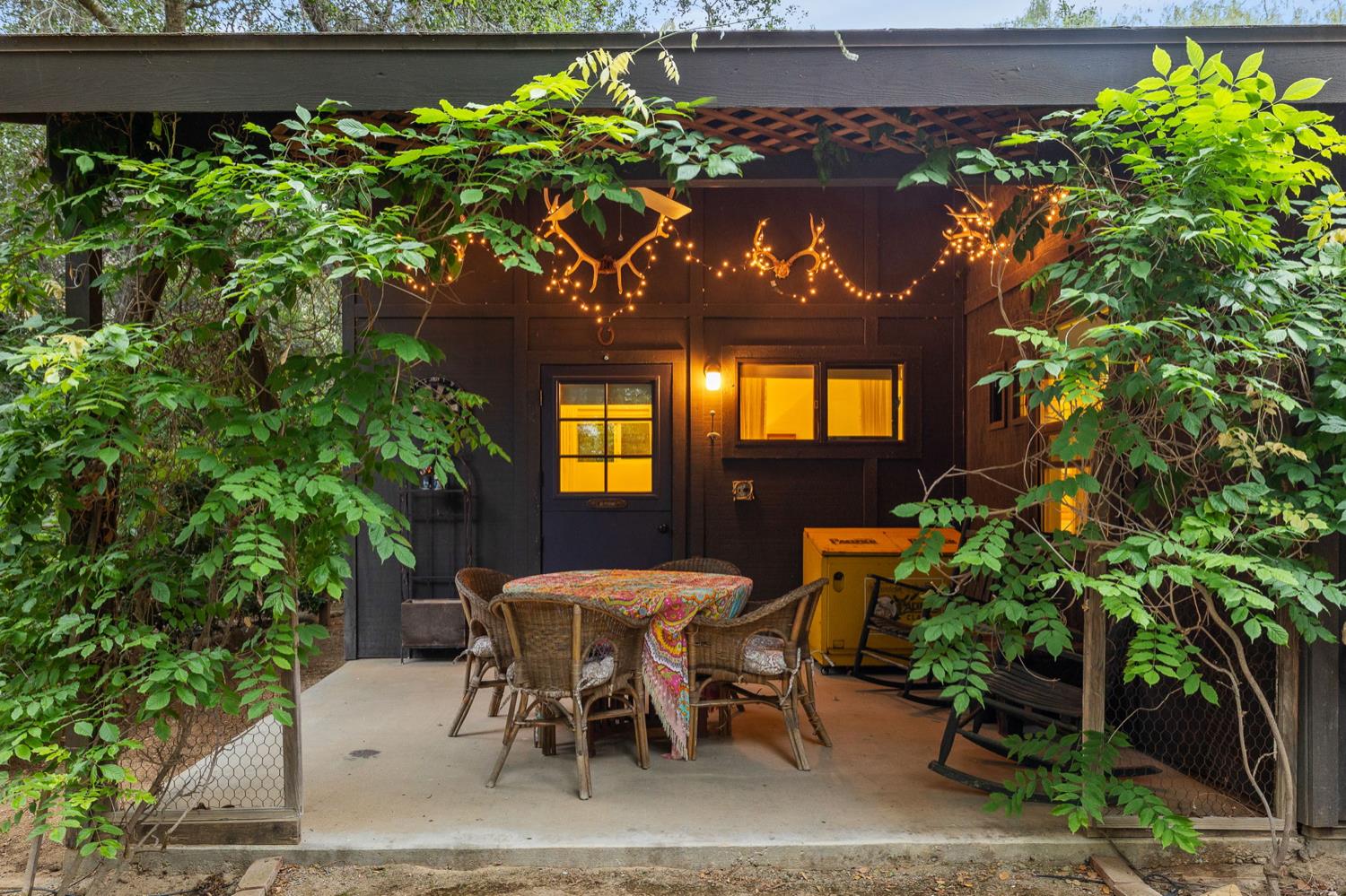 520 Foothill Road Ojai, CA 93023 - Photo 42 of 45 a view of a chairs and table in a backyard