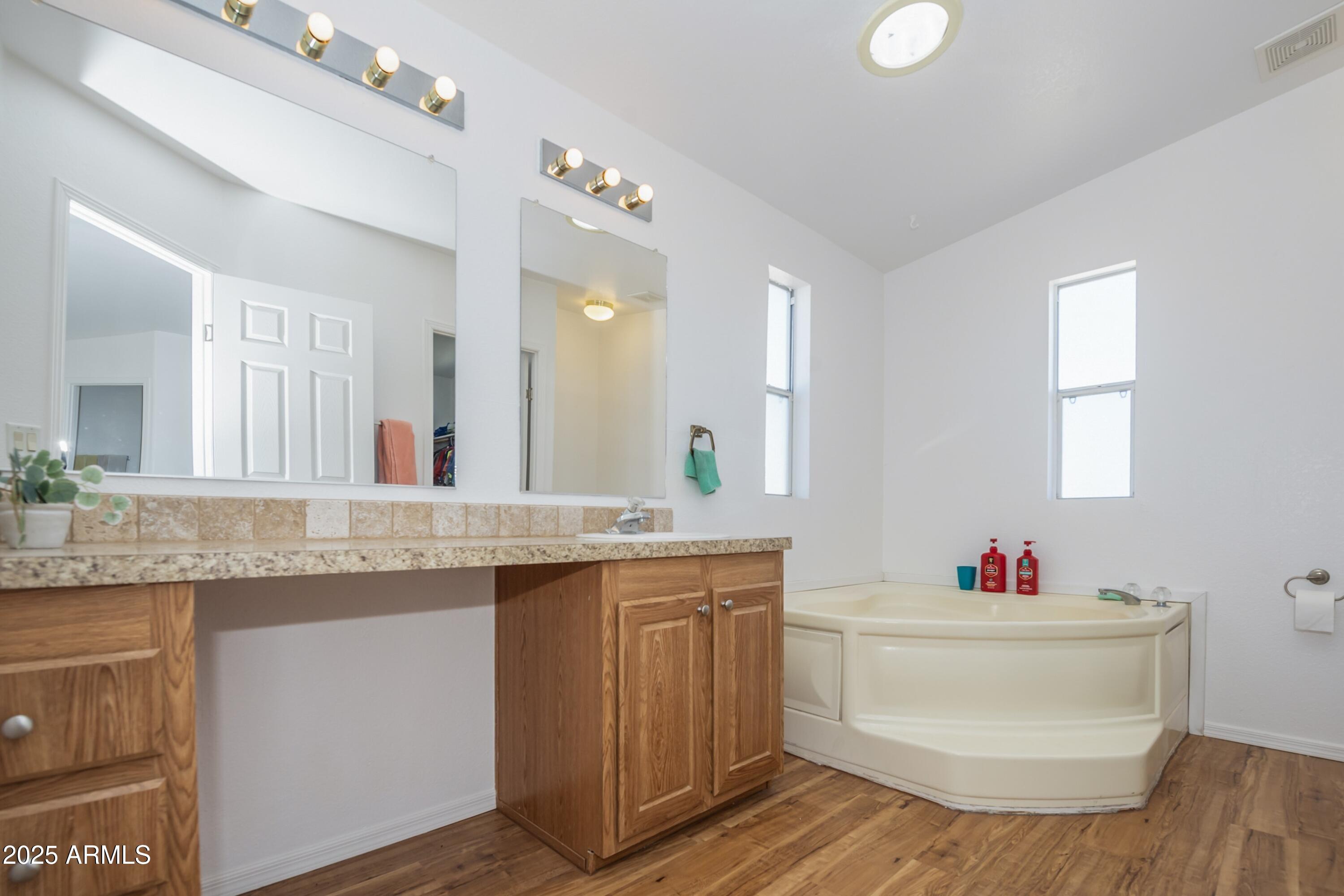 255 West Antelope Run Road Paulden, AZ 86334 - Photo 14 of 26 a bathroom with a granite countertop sink a mirror and a toilet