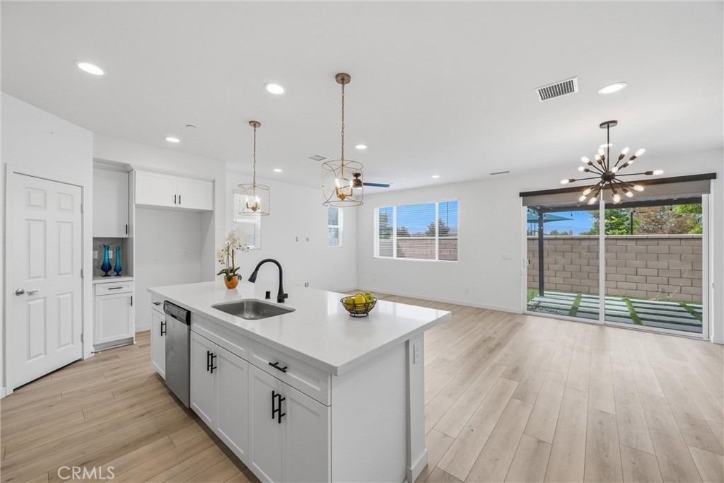 4247 Bravado Court Riverside, CA 92505 - Photo 59 of 60 Modern kitchen opens to the main living area, creating a bright, connected and inviting floor plan