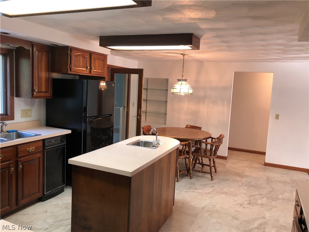 63333 Johnson North Road Bethesda, OH 43719 - Photo 8 of 35 Kitchen with custom lights and dining area with glass shelves
