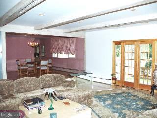 1211 Cox Road Rydal, PA 19046 - Photo 2 of 6 a living room with furniture and a large window