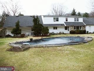 1211 Cox Road Rydal, PA 19046 - Photo 3 of 6 a front view of a house with swimming pool