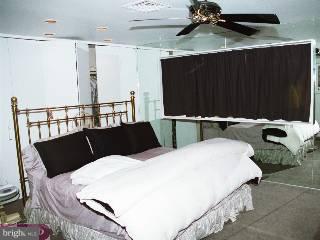 1211 Cox Road Rydal, PA 19046 - Photo 6 of 6 a bed room with a bed and a black furniture