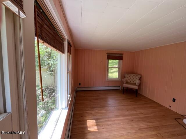 85 Pixley Road Monterey, MA 01230 - Photo 16 of 20 a view of an empty room with a window and wooden floor