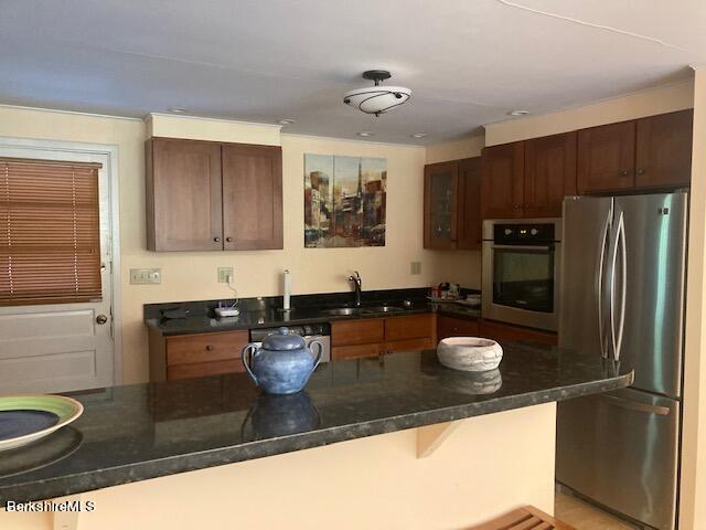 85 Pixley Road Monterey, MA 01230 - Photo 5 of 20 a kitchen with a refrigerator and a stove
