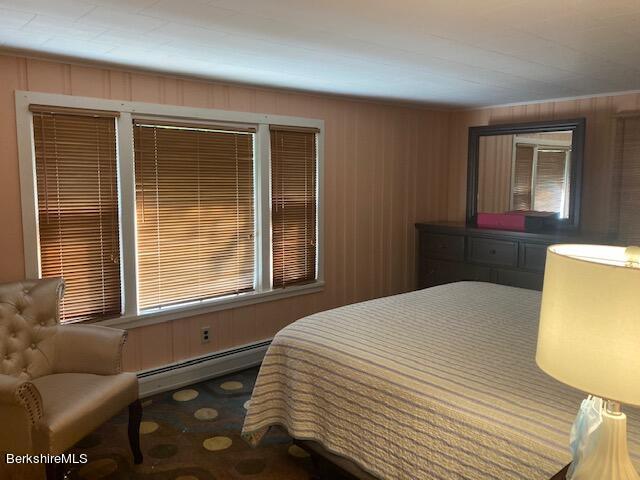 85 Pixley Road Monterey, MA 01230 - Photo 10 of 20 a bedroom with a bed and wooden floor