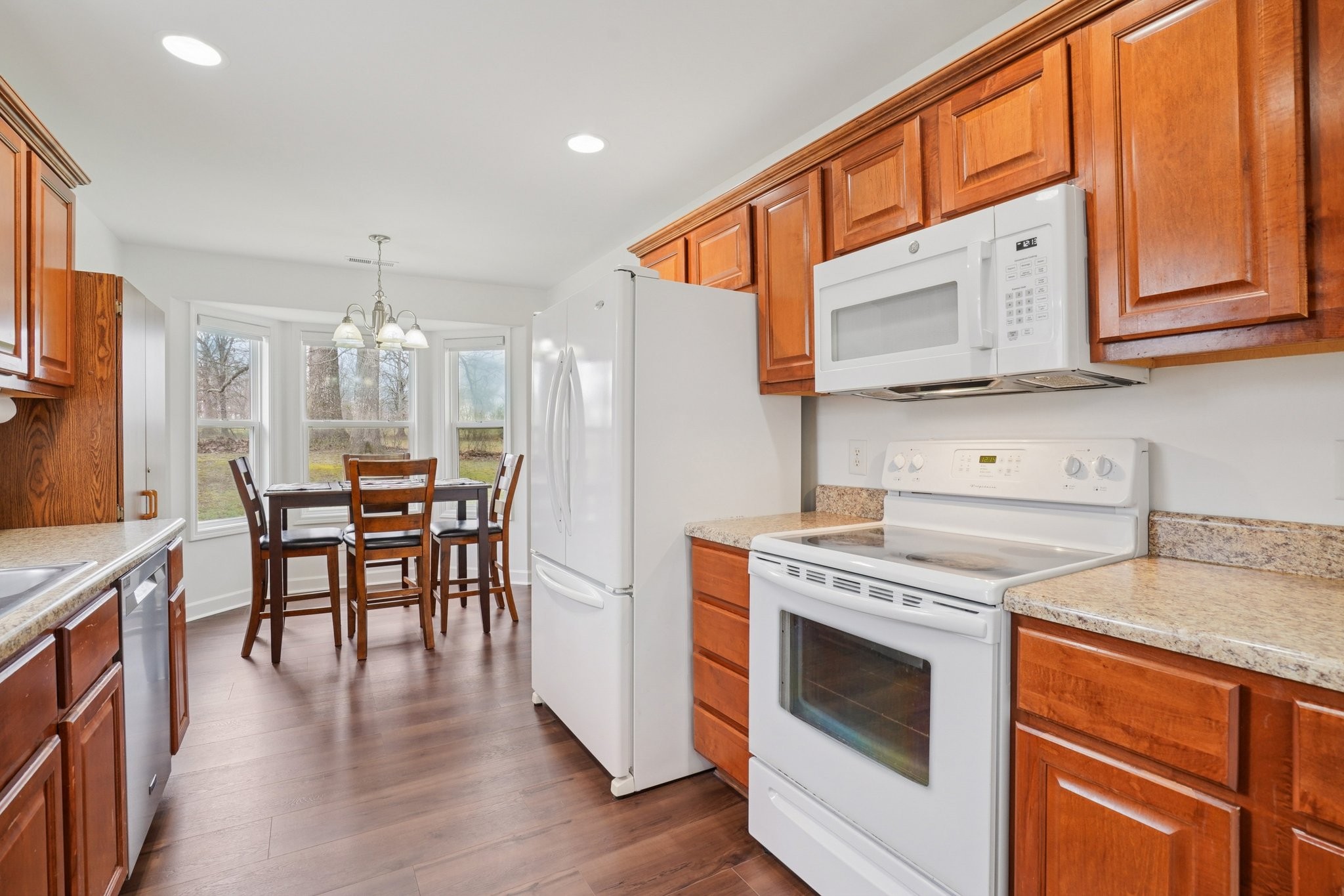 206 Hickory Pointe Dickson, TN 37055 - Photo 12 of 28 a kitchen with a stove a sink and a refrigerator