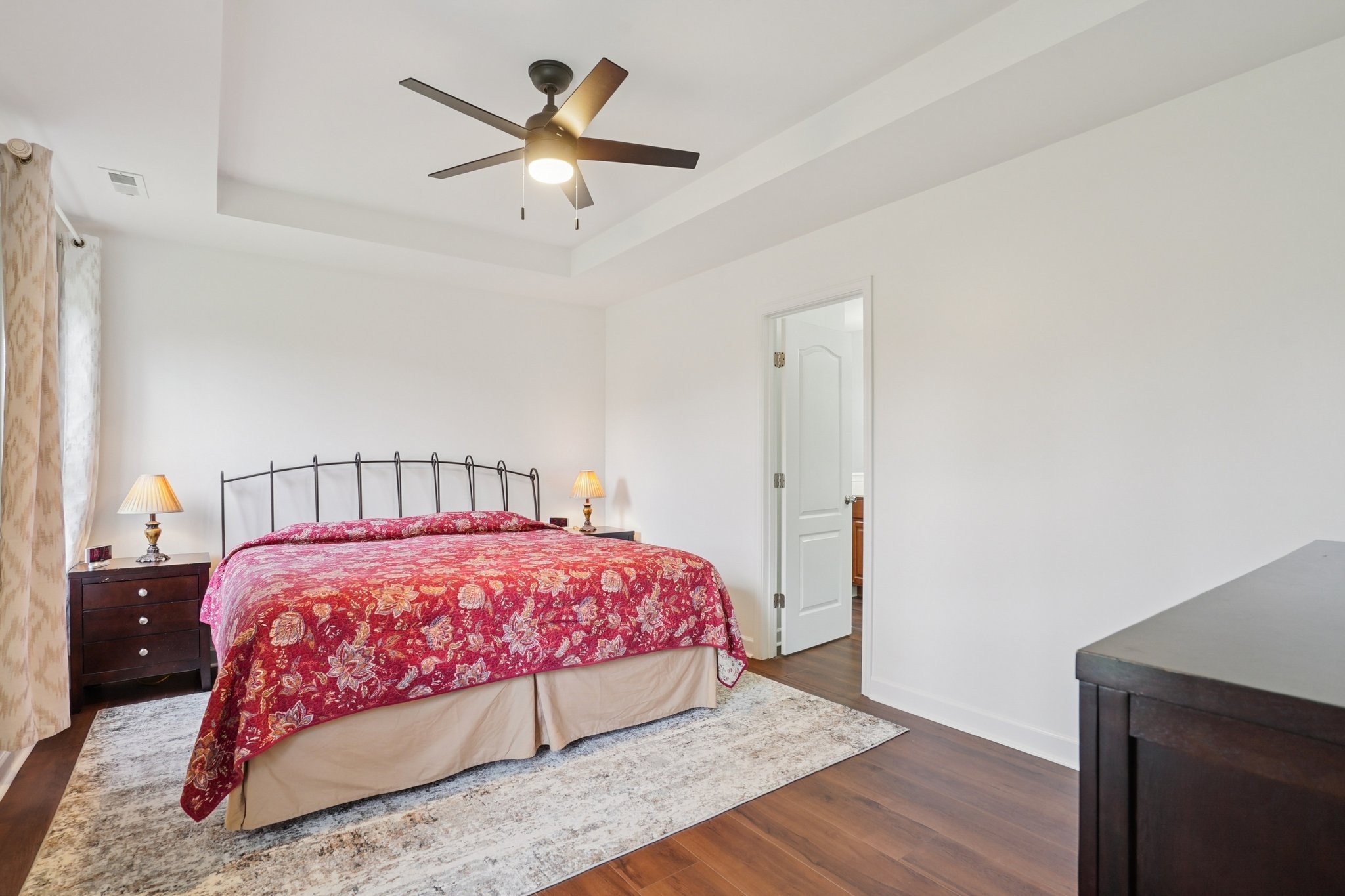 206 Hickory Pointe Dickson, TN 37055 - Photo 19 of 28 a bedroom with a bed and a chandelier