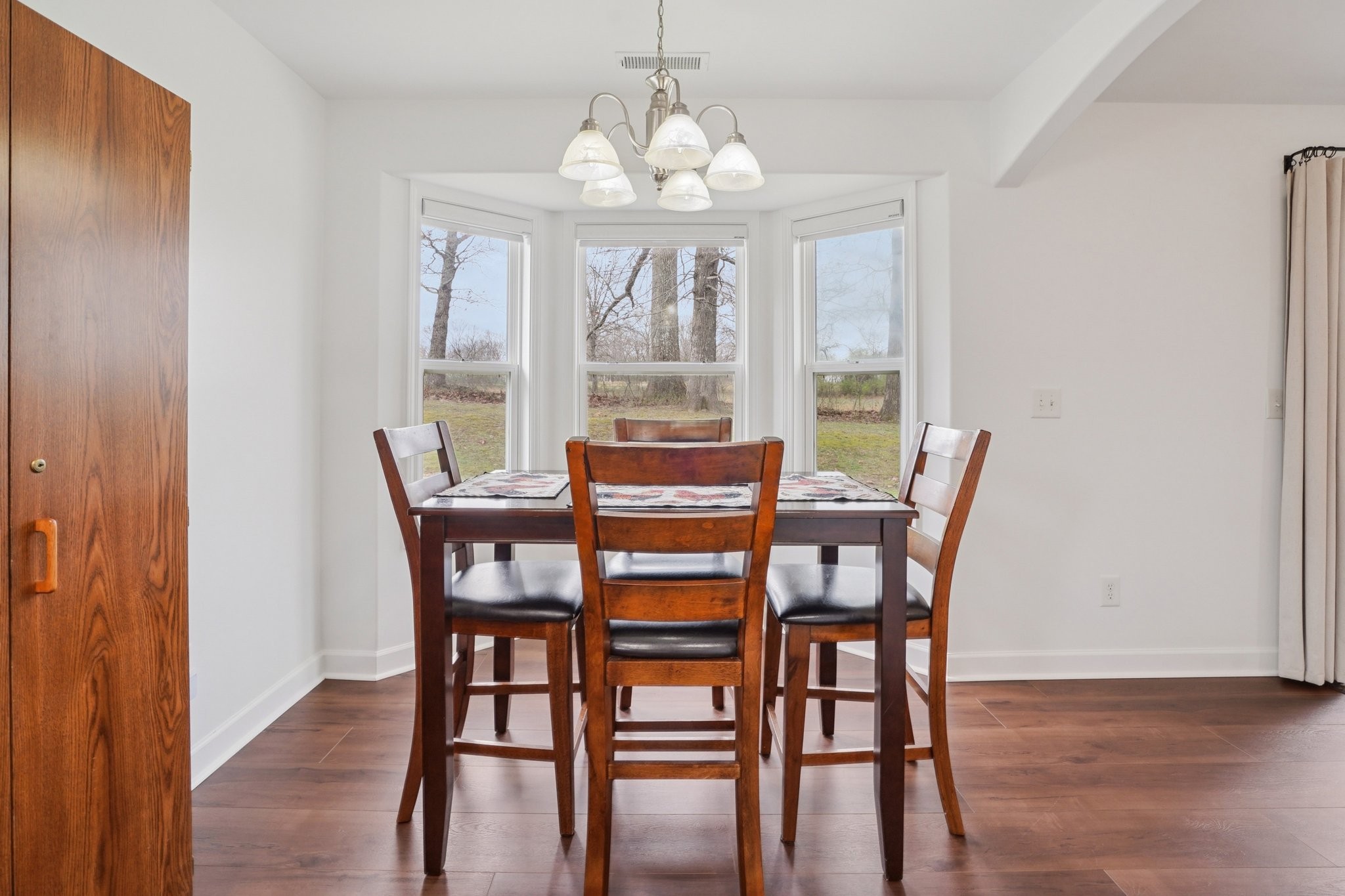 206 Hickory Pointe Dickson, TN 37055 - Photo 10 of 28 a view of a dining room with furniture wooden floor and chandelier
