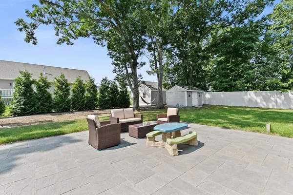 a park view with a bench and a garden