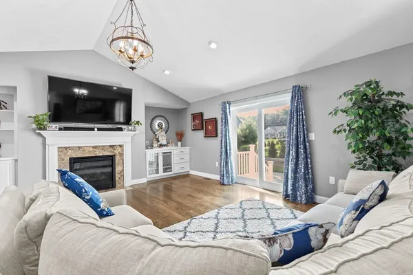 a bedroom with a large bed and a flat screen tv