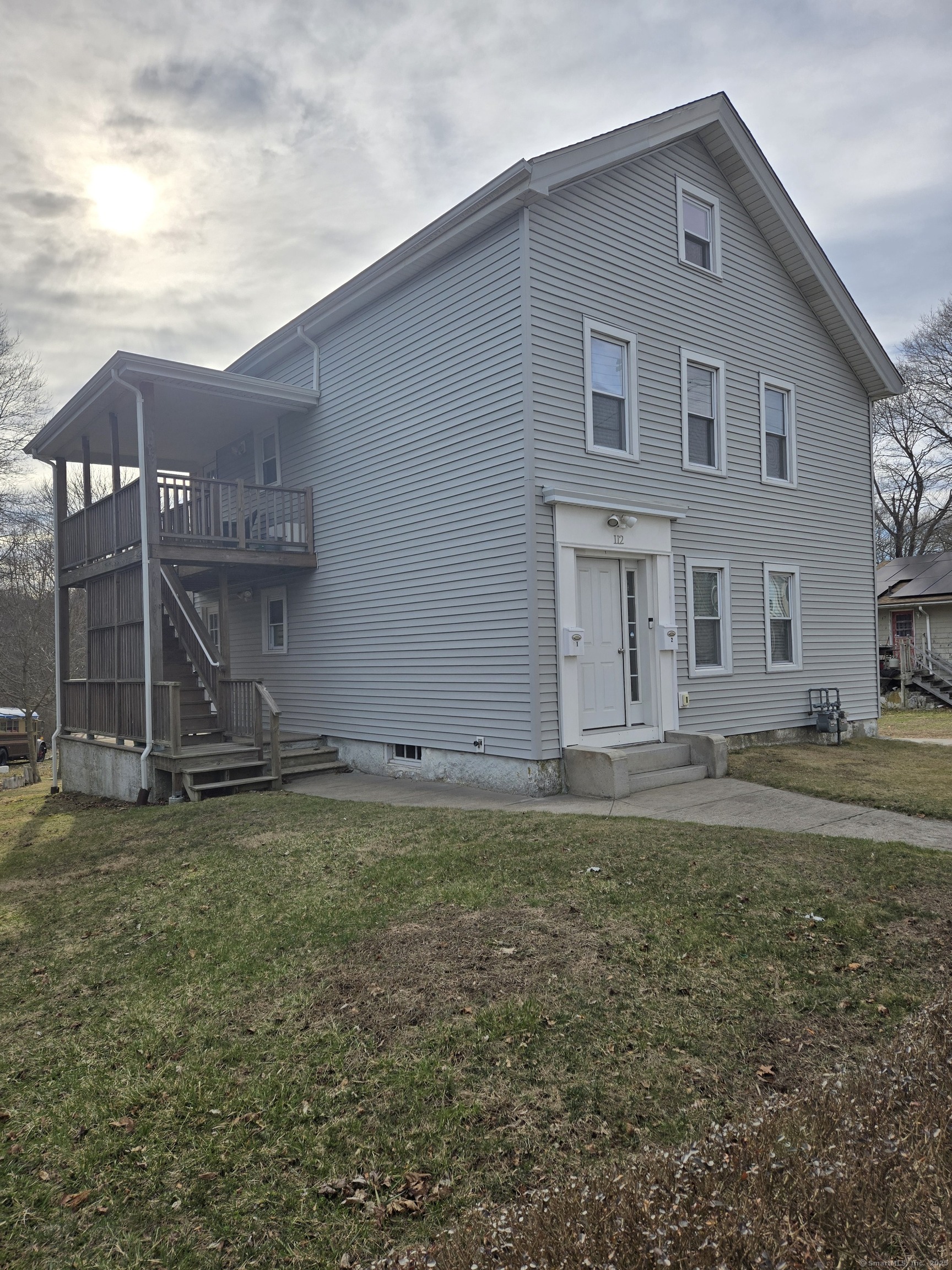112 Liberty Street Pawcatuck, CT 06379 - Photo 1 of 22 a house view with a garden space