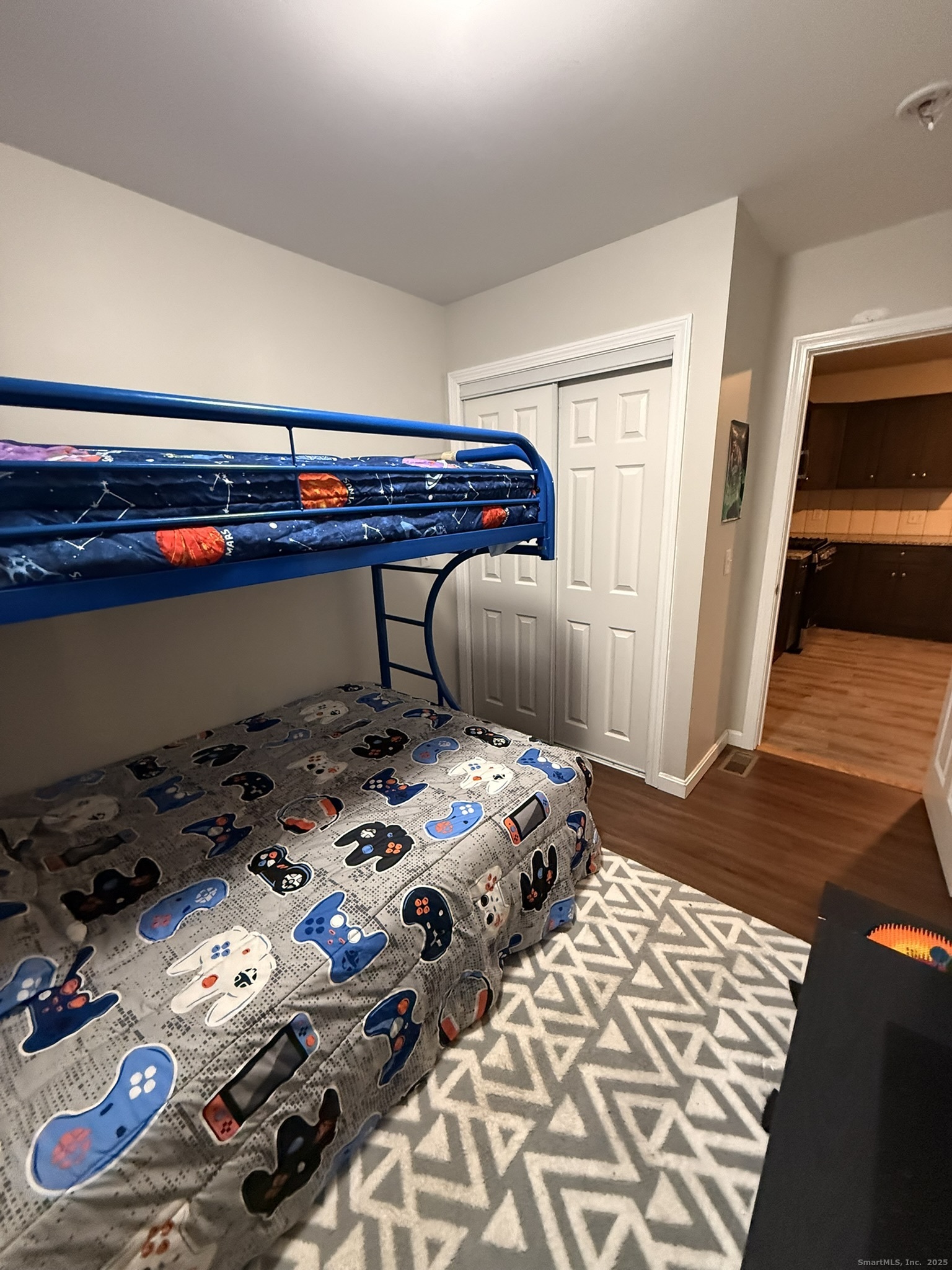 112 Liberty Street Pawcatuck, CT 06379 - Photo 21 of 22 a bedroom with a bed and a dresser