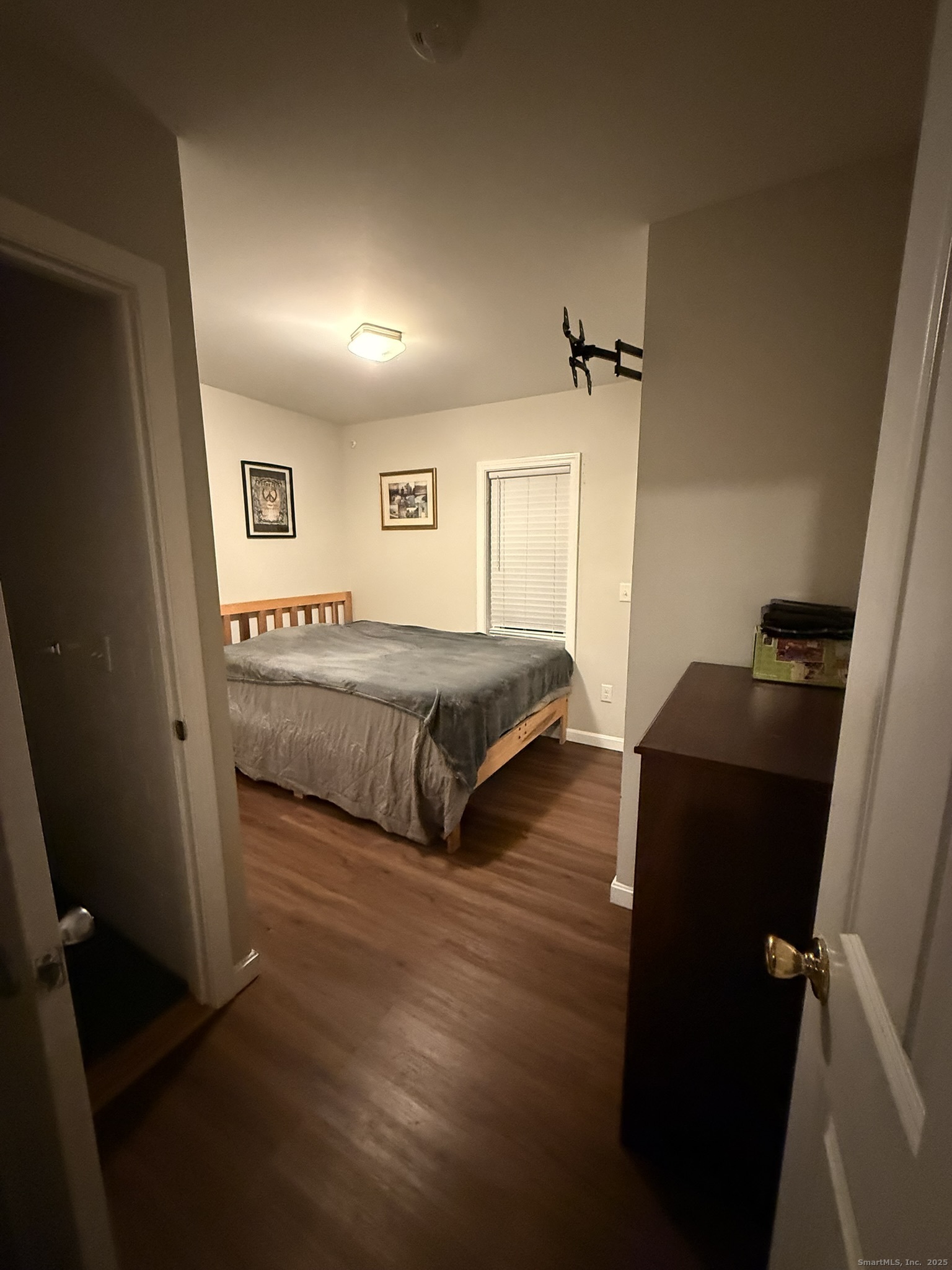 112 Liberty Street Pawcatuck, CT 06379 - Photo 22 of 22 a living room with bed and a window