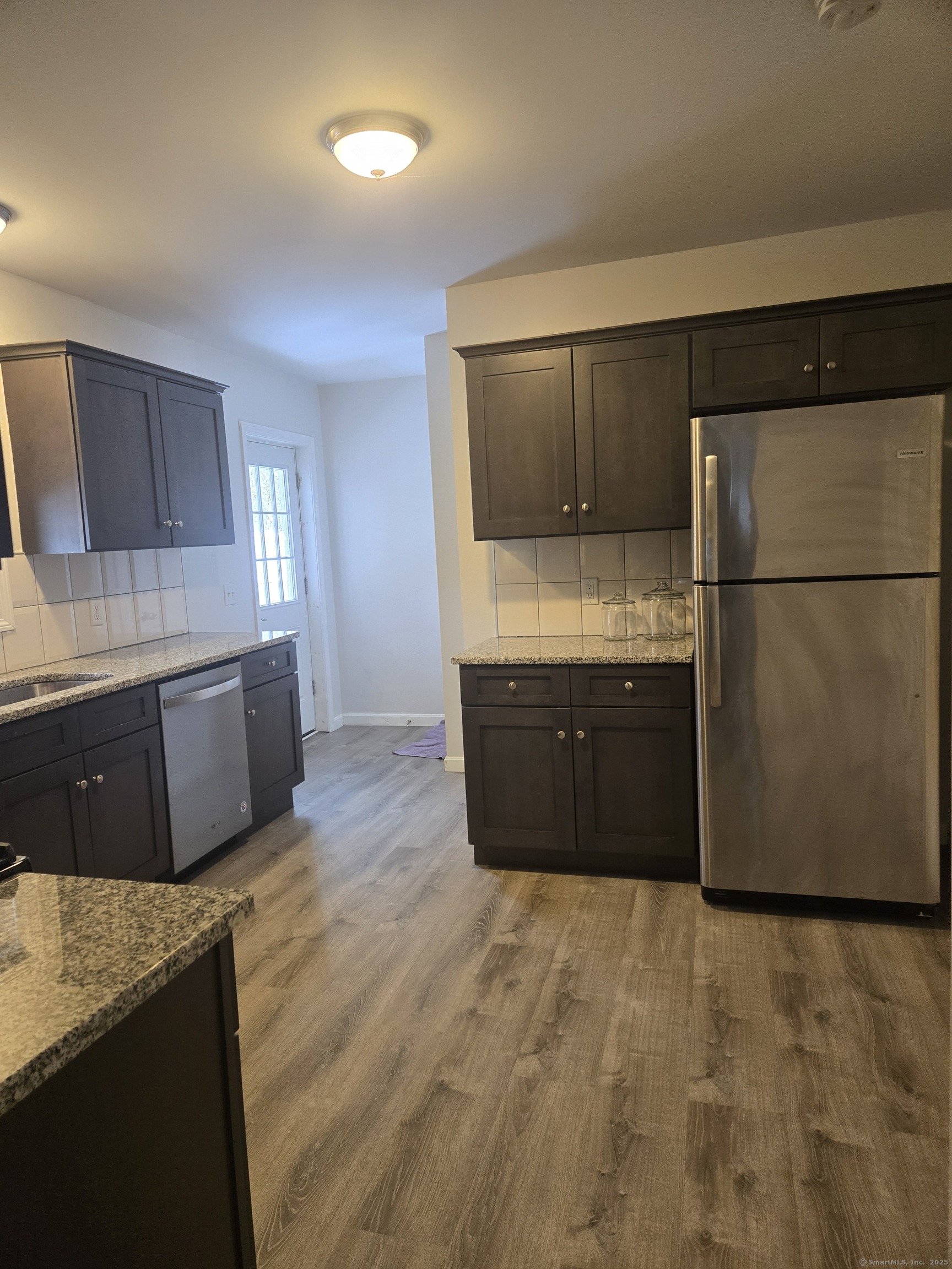 112 Liberty Street Pawcatuck, CT 06379 - Photo 5 of 22 a large kitchen with a sink and a refrigerator