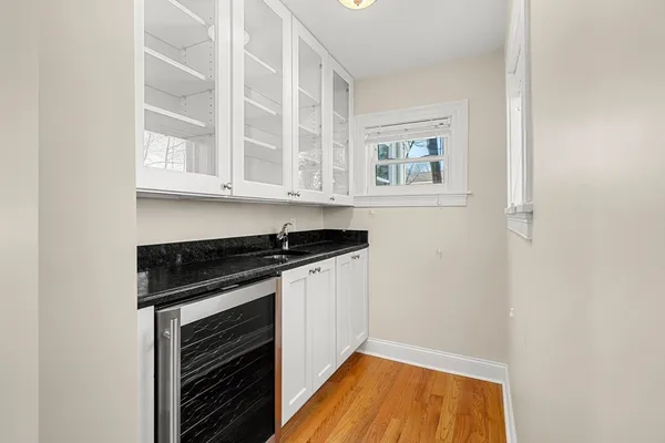a living room with furniture wooden floor and window