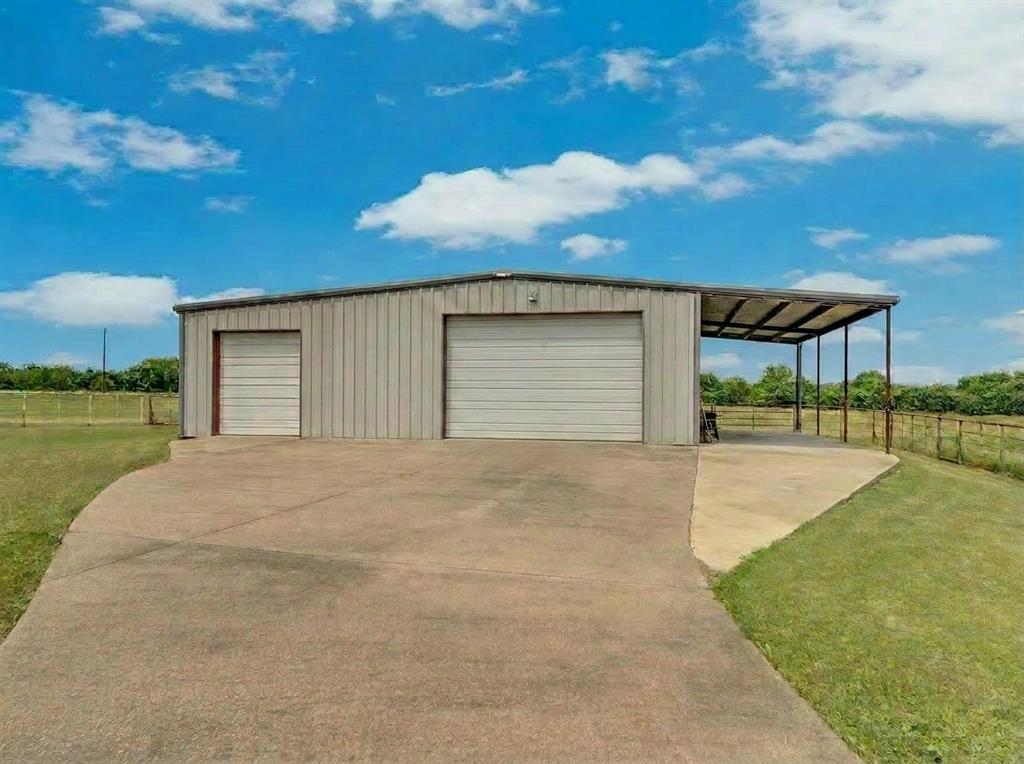 241 Cody Road Ennis, TX 75119 - Photo 36 of 40 43x30 with 13x30 lean-too. 13x30 on left side is enclosed and climate controlled