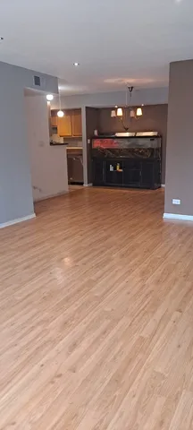 a view of a room with furniture and a chandelier