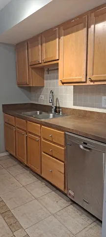 a kitchen with stainless steel appliances granite countertop a sink and a cabinets