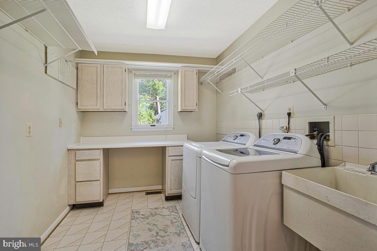 7887 Poplar Grove Road Severn, MD 21144 - Photo 33 of 49 Sunny, oversized laundry on first level