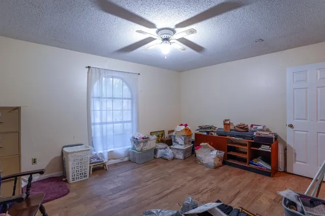 a view of kitchen with sink microwave and stove