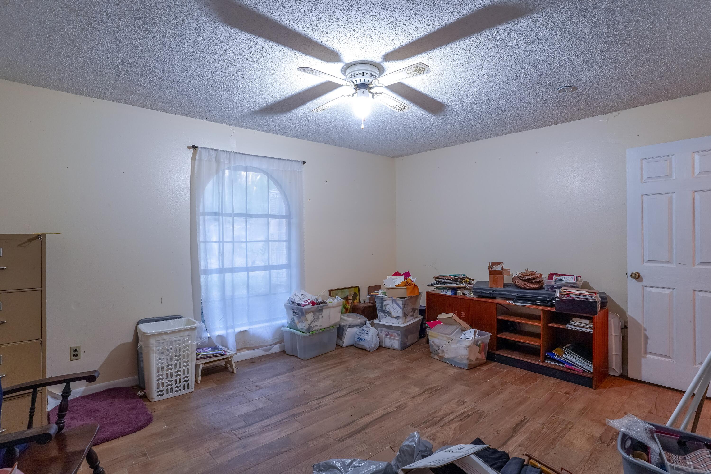 4444 Sundance Way Holt, FL 32564 - Photo 18 of 39 a living room with furniture and a window