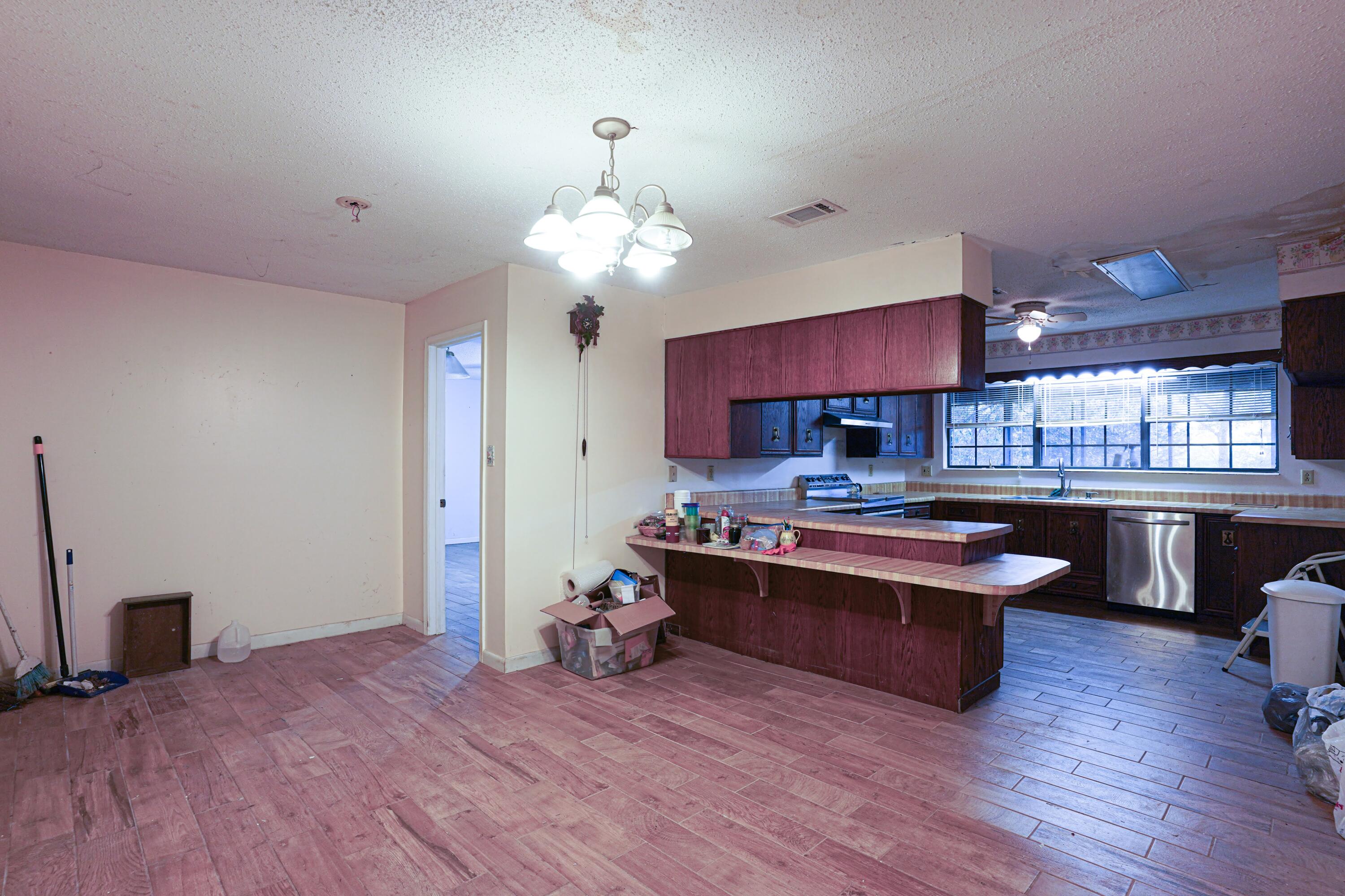 4444 Sundance Way Holt, FL 32564 - Photo 19 of 39 a view of kitchen with sink microwave and stove